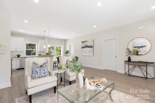 212 Queens Ct, Gastonia, NC 28052 - living room featuring light wood-style floors, baseboards, and recessed lighting