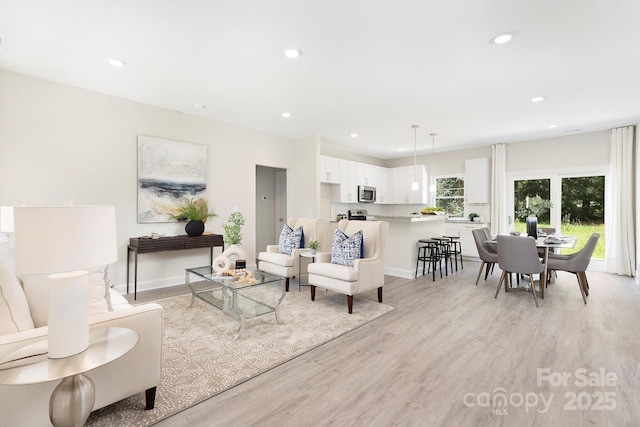 212 Queens Ct, Gastonia, NC 28052 - living area with light wood finished floors, recessed lighting, and baseboards