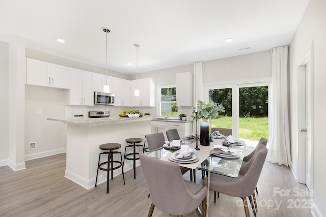 212 Queens Ct, Gastonia, NC 28052 - dining space with light wood-style floors, recessed lighting, and baseboards