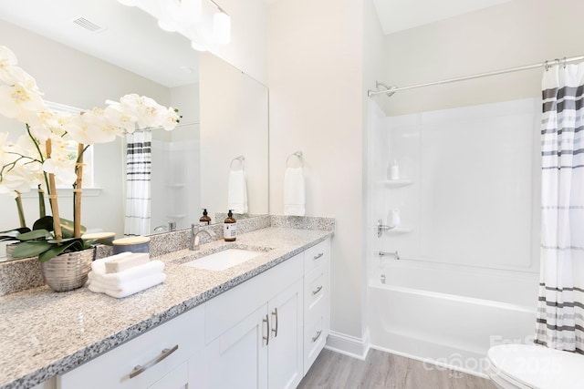 212 Queens Ct, Gastonia, NC 28052 - bathroom with toilet, vanity, shower / bathtub combination with curtain, wood finished floors, and baseboards