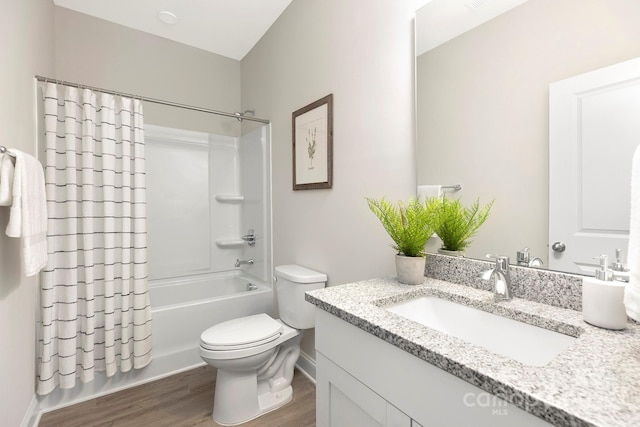 212 Queens Ct, Gastonia, NC 28052 - bathroom featuring vanity, wood finished floors, toilet, and shower / bath combo with shower curtain