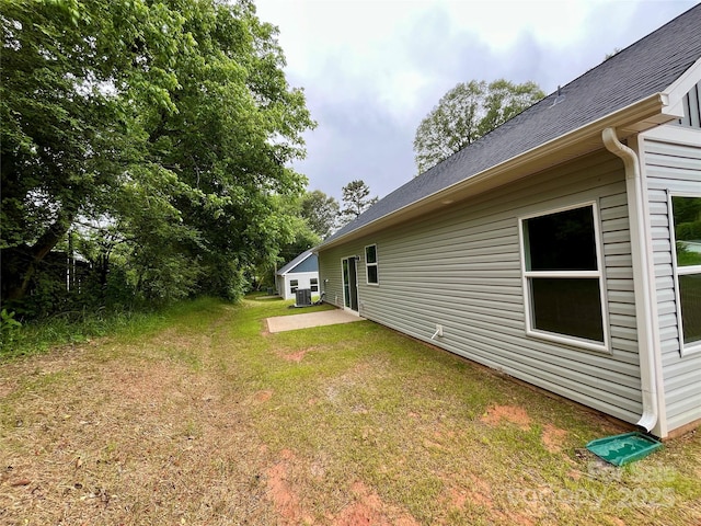 212 Queens Ct, Gastonia, NC 28052 - view of green lawn featuring a patio and central AC