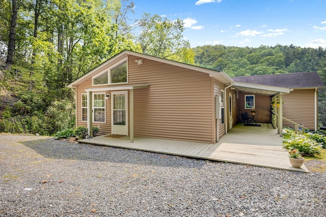 2763 Crabtree Rd, Spruce Pine, NC 28777 - view of side of home with a shingled roof and a wooden deck