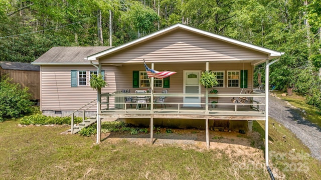 2763 Crabtree Rd, Spruce Pine, NC 28777 - view of front of house featuring a porch, crawl space, a front yard, and roof with shingles