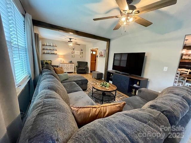 135 Michelle Dr, Ellenboro, NC 28040 - living area with a ceiling fan, beam ceiling, and wood finished floors