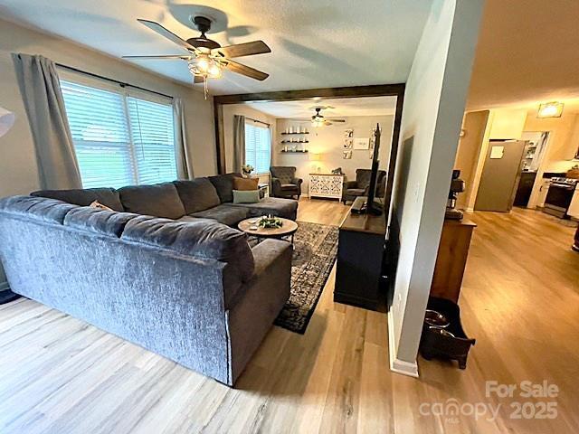 135 Michelle Dr, Ellenboro, NC 28040 - living area with ceiling fan and wood finished floors