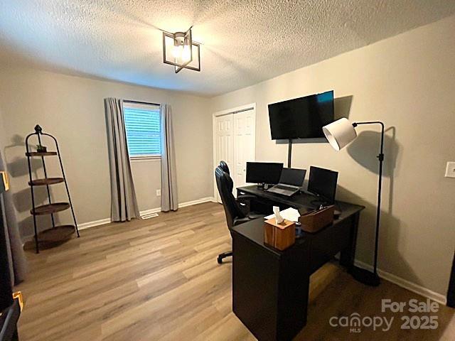 135 Michelle Dr, Ellenboro, NC 28040 - office featuring wood finished floors, a textured ceiling, and baseboards