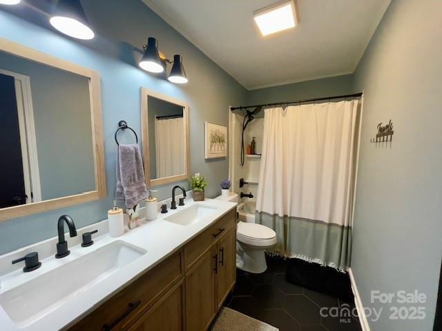 135 Michelle Dr, Ellenboro, NC 28040 - bathroom featuring toilet, double vanity, shower / bath combination with curtain, and tile patterned floors