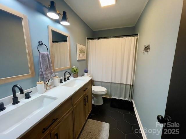 135 Michelle Dr, Ellenboro, NC 28040 - full bath featuring toilet, double vanity, tile patterned flooring, and a shower with curtain