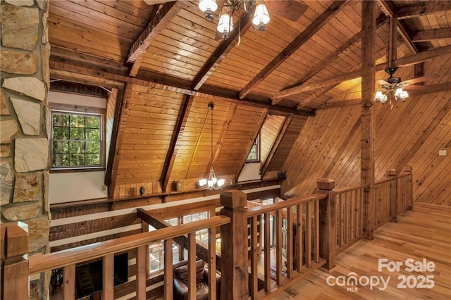 2709 Blythe Rd, Waxhaw, NC 28173 - staircase with a chandelier, wooden ceiling, wood walls, wood finished floors, and a ceiling fan