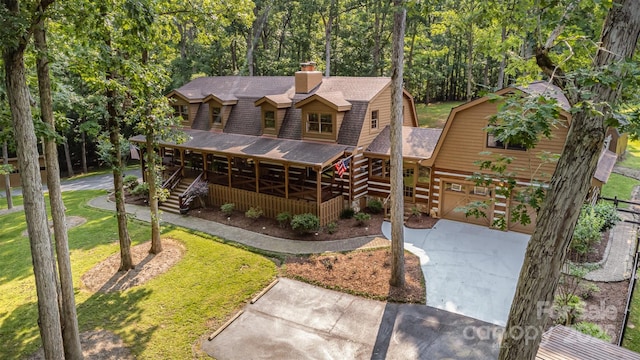 2709 Blythe Rd, Waxhaw, NC 28173 - view of front facade with a gambrel roof, roof with shingles, a chimney, concrete driveway, and stairs