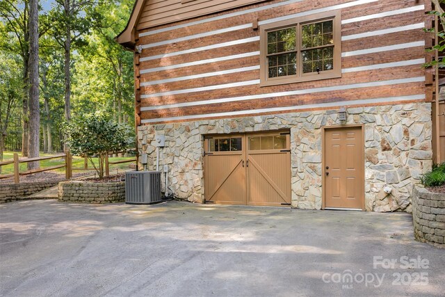 2709 Blythe Rd, Waxhaw, NC 28173 - entrance to property featuring stone siding and cooling unit