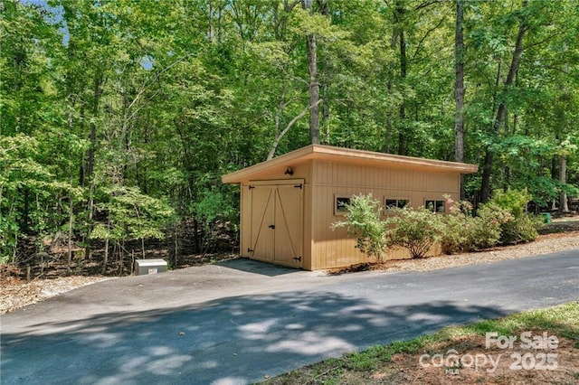 2709 Blythe Rd, Waxhaw, NC 28173 - view of shed with a view of trees and driveway