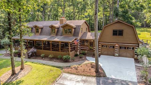 2709 Blythe Rd, Waxhaw, NC 28173 - view of front of property featuring a gambrel roof, covered porch, a shingled roof, stairs, and a chimney