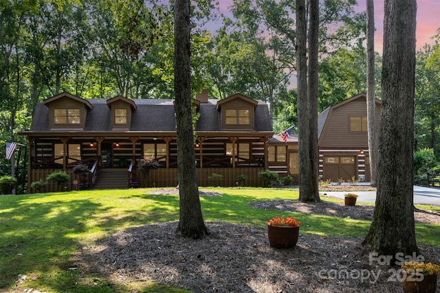 2709 Blythe Rd, Waxhaw, NC 28173 - log-style house with a shingled roof, covered porch, and a yard