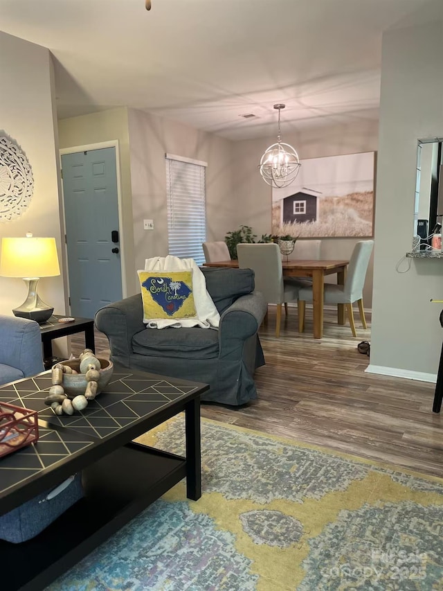 229 Windsor Point Rd Unit 6B, Columbia, SC 29223 - living room with wood finished floors, a chandelier, and baseboards