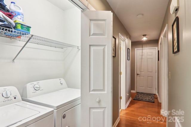 123 Brandymill Loop, Etowah, NC 28729 - laundry area with washer and dryer, light wood-type flooring, and baseboards
