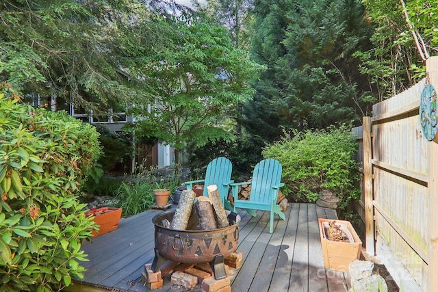 123 Brandymill Loop, Etowah, NC 28729 - wooden terrace featuring an outdoor fire pit