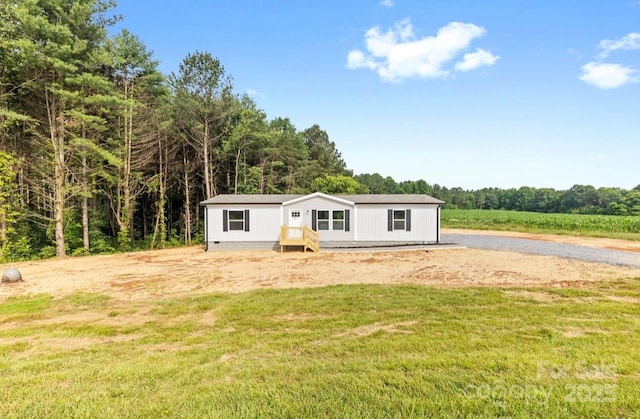 977 Myers Mill Rd, Olin, NC 28660 - manufactured / mobile home with a front lawn and a wooded view