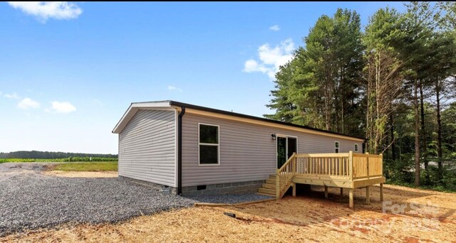 977 Myers Mill Rd, Olin, NC 28660 - rear view of house with crawl space and a wooden deck