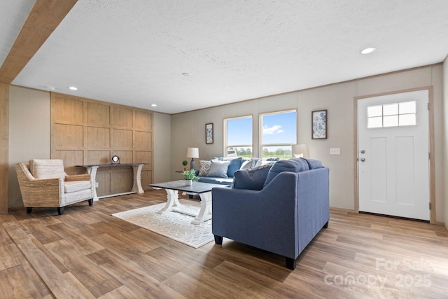977 Myers Mill Rd, Olin, NC 28660 - living area featuring light wood-style floors, plenty of natural light, recessed lighting, and a textured ceiling