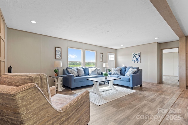 977 Myers Mill Rd, Olin, NC 28660 - living room with a textured ceiling, light wood-style floors, and recessed lighting
