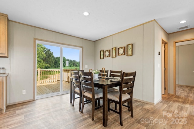 977 Myers Mill Rd, Olin, NC 28660 - dining room with light wood finished floors, ornamental molding, recessed lighting, and a decorative wall