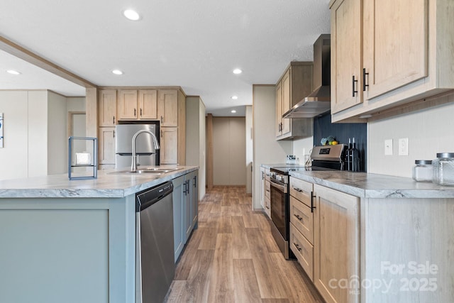 977 Myers Mill Rd, Olin, NC 28660 - kitchen featuring stainless steel appliances, wall chimney exhaust hood, light wood-style flooring, light brown cabinets, and recessed lighting