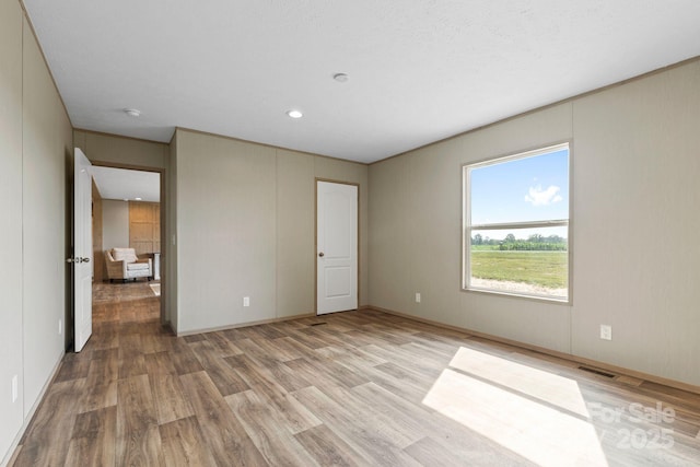 977 Myers Mill Rd, Olin, NC 28660 - unfurnished bedroom featuring light wood-style floors and recessed lighting