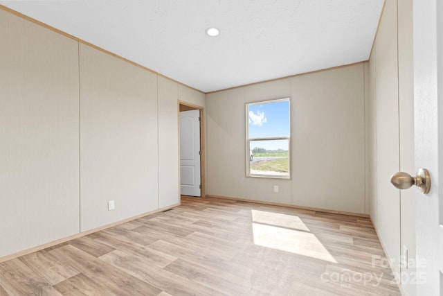977 Myers Mill Rd, Olin, NC 28660 - unfurnished room featuring light wood-type flooring and crown molding