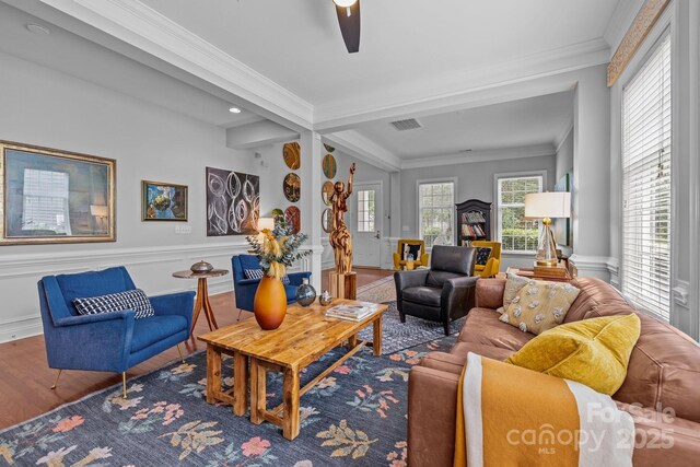 2009 Waterbury Ln, Waxhaw, NC 28173 - living area with wood finished floors, crown molding, a wainscoted wall, a ceiling fan, and recessed lighting