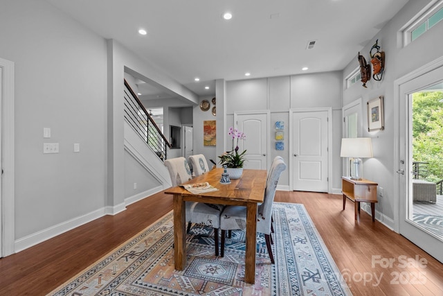 2009 Waterbury Ln, Waxhaw, NC 28173 - dining room with wood finished floors, recessed lighting, and stairs