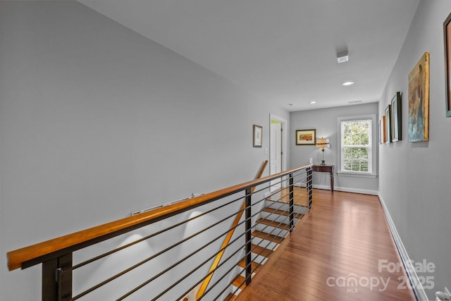 2009 Waterbury Ln, Waxhaw, NC 28173 - hallway with an upstairs landing, wood finished floors, and recessed lighting