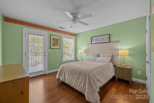 2009 Waterbury Ln, Waxhaw, NC 28173 - bedroom featuring access to outside, dark wood-style flooring, and a ceiling fan