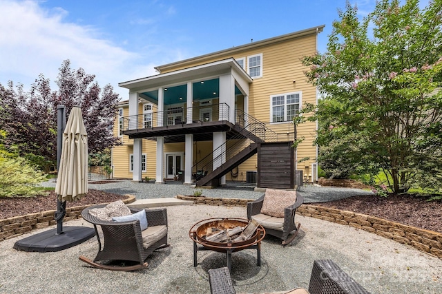 2009 Waterbury Ln, Waxhaw, NC 28173 - back of house with a fire pit, a patio, french doors, stairway, and a wooden deck
