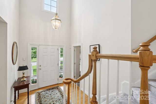 11103 Fountaingrove Dr, Charlotte, NC 28262 - entrance foyer with a towering ceiling, wood finished floors, and stairway