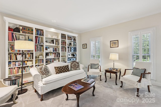 11103 Fountaingrove Dr, Charlotte, NC 28262 - living area featuring plenty of natural light, carpet, and ornamental molding