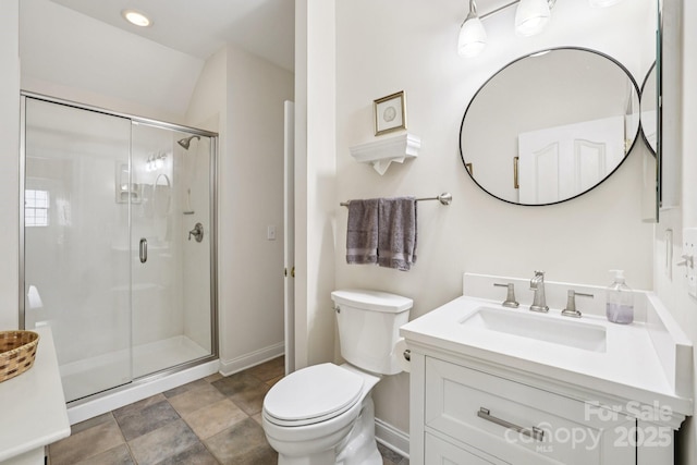 11103 Fountaingrove Dr, Charlotte, NC 28262 - bathroom featuring vanity, toilet, a stall shower, baseboards, and stone finish floors