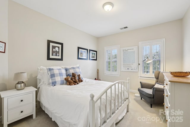 11103 Fountaingrove Dr, Charlotte, NC 28262 - bedroom with light colored carpet and baseboards
