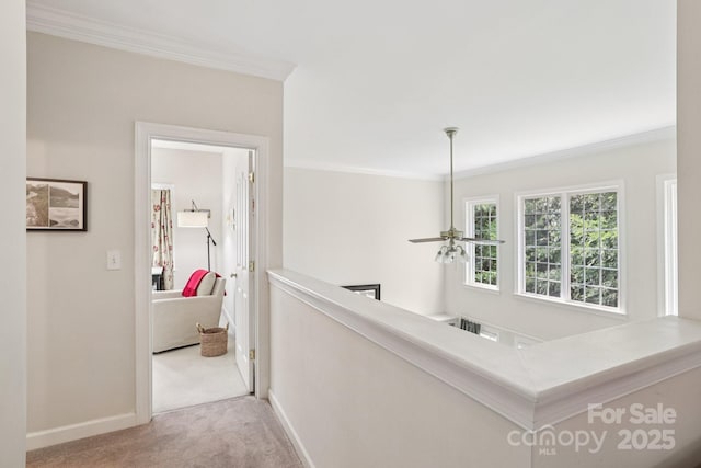 11103 Fountaingrove Dr, Charlotte, NC 28262 - hall with carpet, crown molding, baseboards, and an upstairs landing