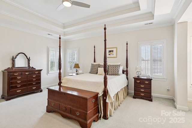 11103 Fountaingrove Dr, Charlotte, NC 28262 - bedroom with a tray ceiling, ornamental molding, light colored carpet, and multiple windows