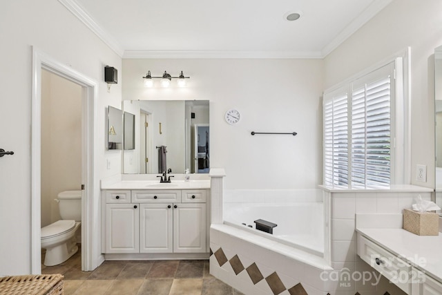 11103 Fountaingrove Dr, Charlotte, NC 28262 - bathroom featuring toilet, vanity, a garden tub, and ornamental molding