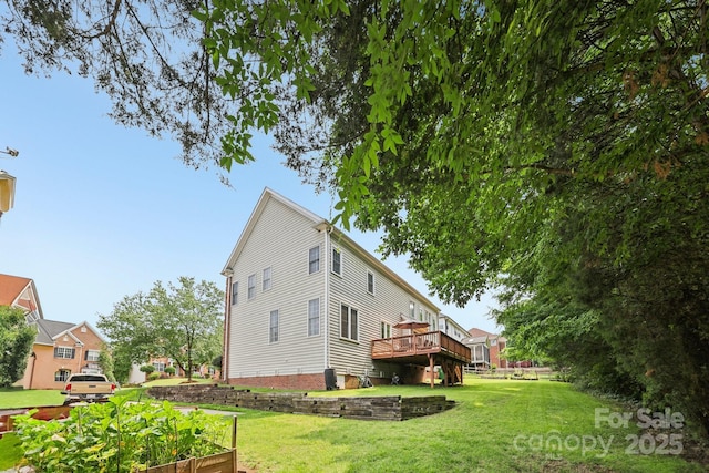 11103 Fountaingrove Dr, Charlotte, NC 28262 - view of side of property featuring a lawn and a wooden deck