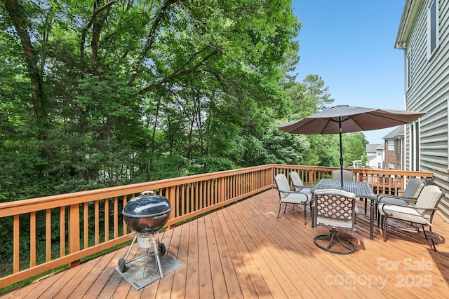 11103 Fountaingrove Dr, Charlotte, NC 28262 - wooden deck with outdoor dining space