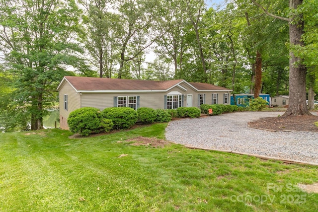 7232 Executive Cir, Denver, NC 28037 - ranch-style home with a front yard and gravel driveway