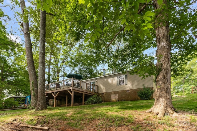 7232 Executive Cir, Denver, NC 28037 - rear view of property with a wooden deck and a lawn