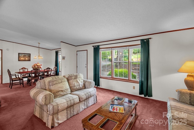 7232 Executive Cir, Denver, NC 28037 - living room featuring carpet floors, crown molding, a chandelier, a textured ceiling, and vaulted ceiling