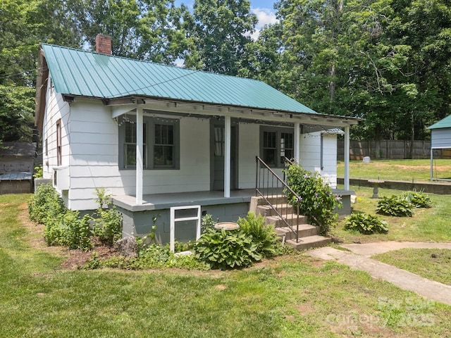 6 Willies Hl, Fletcher, NC 28732 - bungalow with a chimney, covered porch, and metal roof