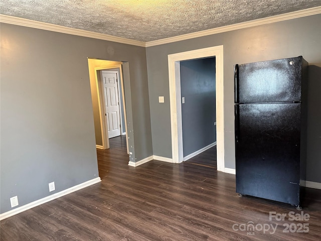 303 Southern Ave, East Spencer, NC 28039 - empty room featuring wood finished floors, baseboards, a textured ceiling, and crown molding