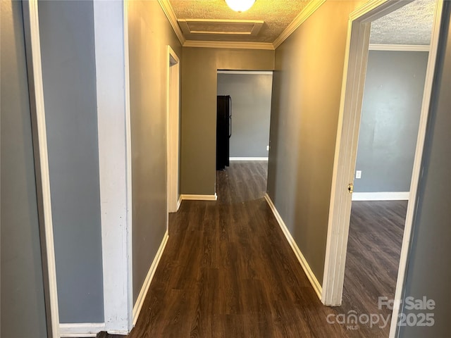 303 Southern Ave, East Spencer, NC 28039 - corridor with wood finished floors, ornamental molding, attic access, baseboards, and a textured ceiling
